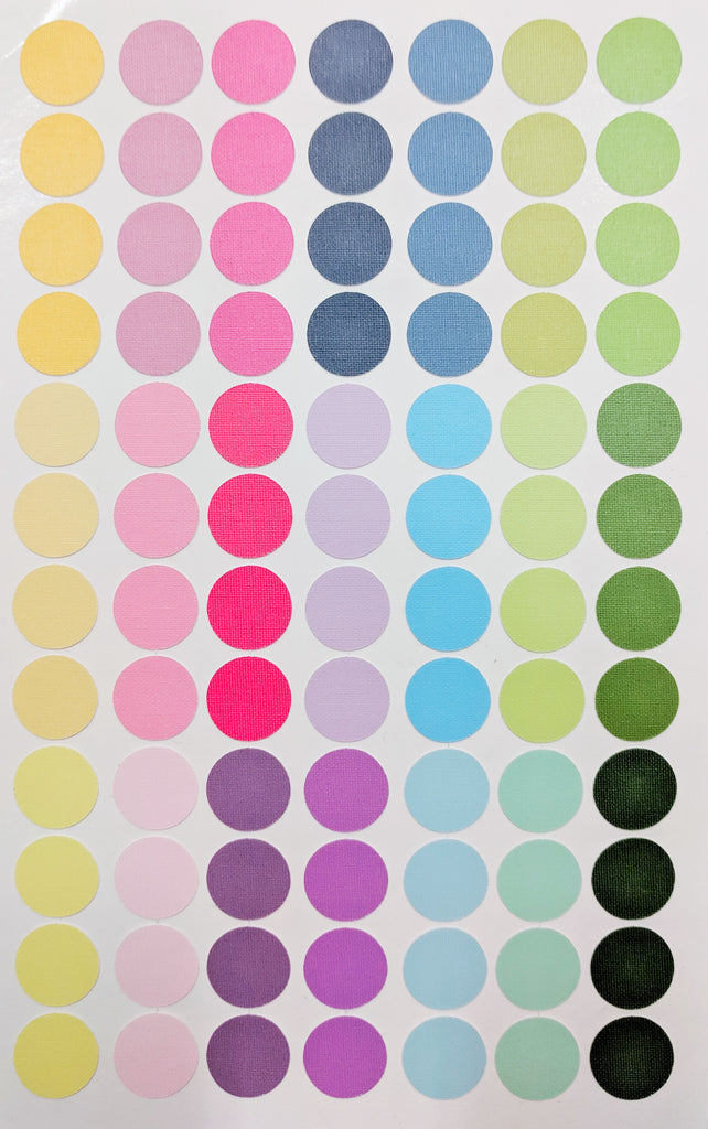 84 rainbow colored circular stickers on a sheet